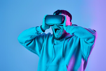 man using virtual reality glasses and playing video games