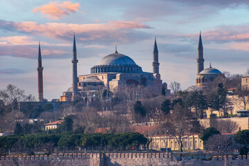 Fototapeta na wymiar Hagia Sophia view from Bosphorus in Istanbul. Cloudy Sunset Sky.