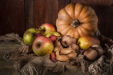 Naklejka na ściany i meble Pumpkin and fruits with nuts