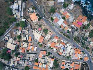 Aerial photos of Cidade Velha in Santiago, Cape Verde, reveal a historic town with a stunning coastline, a UNESCO World Heritage Site, showcasing colonial-era architecture, picturesque streets.