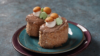 Biscuit-cream cakes decorated with cream flowers and Mushrooms