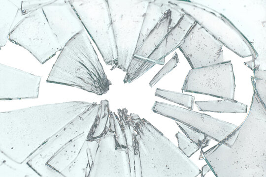 Broken glass on transparent background with glass cracks and splinters. Can be put on any image, glass parts are transparent also