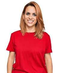 Fototapeta premium Hispanic young woman wearing casual red t shirt with a happy and cool smile on face. lucky person.