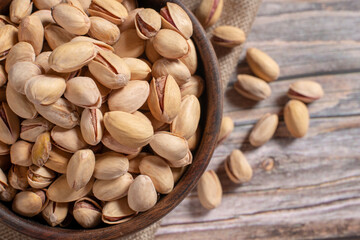 pistachio nuts on wooden background