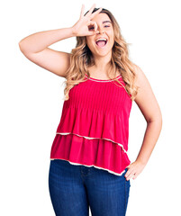 Young caucasian woman wearing casual clothes smiling happy doing ok sign with hand on eye looking through fingers