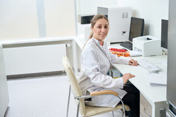 Woman doctor at the workplace in the diagnostic laboratory