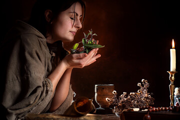 medieval poor healer smells herbs