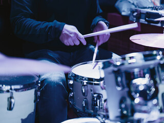 Fototapeta na wymiar Musician playing the drums during a concert
