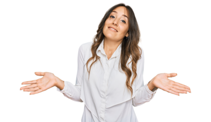 Young brunette woman wearing casual clothes clueless and confused expression with arms and hands raised. doubt concept.