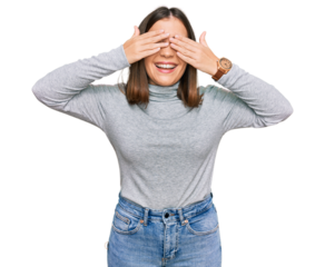 Young beautiful woman wearing casual turtleneck sweater covering eyes with hands smiling cheerful and funny. blind concept.