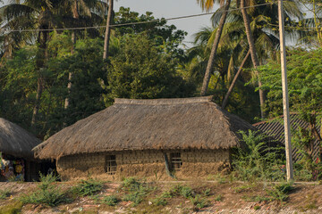 Fototapeta na wymiar 11th February, 2023, Sundarban, West Bengal, India: A small Indian village house made with clay and straw at Sundarban..