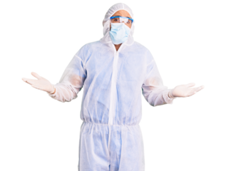 Young hispanic man wearing doctor protection coronavirus uniform and medical mask clueless and confused expression with arms and hands raised. doubt concept.