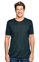 Fototapeta premium Handsome caucasian man wearing casual clothes with a happy and cool smile on face. lucky person.