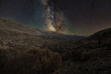 Mountain range on crete with milkway by night.