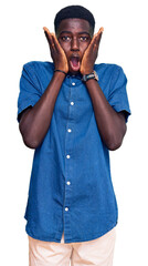 Young african american man wearing casual clothes afraid and shocked, surprise and amazed...