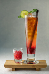 Ice tea menu colorful cool ice tea lemonade cocktails in glasses with straw on gray background. Mix...