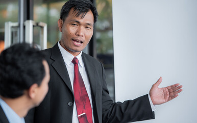 Speaker Motivational by present document to boss colleagues to decide. coworker coach explain Analysis Statistics Report drawing graph presentation to business improvement teamwork.