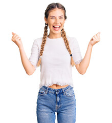 Beautiful caucasian woman with blonde hair wearing braids and white tshirt screaming proud,...