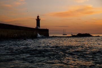 Fototapeta na wymiar Ocean lighthouse at the sunset.