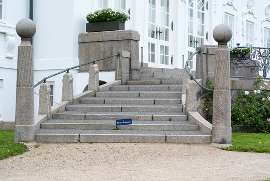The exterior of the Royal Marselisborg Palace, People visit the garden around the castle