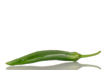 One green spicy pepper, macro, isolated on a white background.