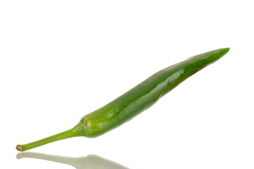 One green spicy pepper, macro, isolated on a white background.