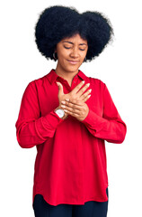 Young african american girl wearing casual clothes suffering pain on hands and fingers, arthritis inflammation