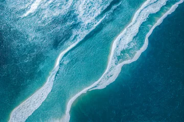 Foto op Plexiglas Spectacular aerial top view background photo of ocean sea water white wave splashing in the deep sea. Drone photo backdrop of sea wave in bird eye waves. © Summit Art Creations