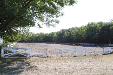 Beautiful photo of empty equestrian field for horse training