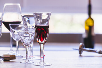 Elegant glasses of wine on a kitchen table