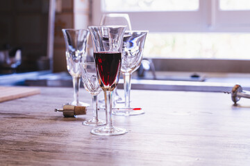 Elegant glasses of wine on a kitchen table