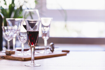 Elegant glasses of wine on a kitchen table