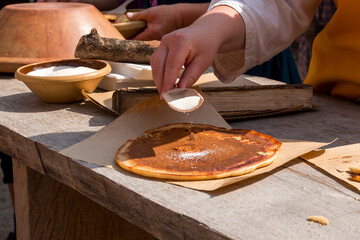 Pancakes are sprinkled with sugar in the 1700s