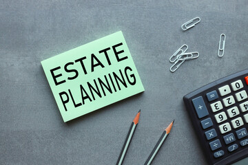 Estate Planning - Tax Liens . text on green sticker. on a gray background near bright stickers and paper clips