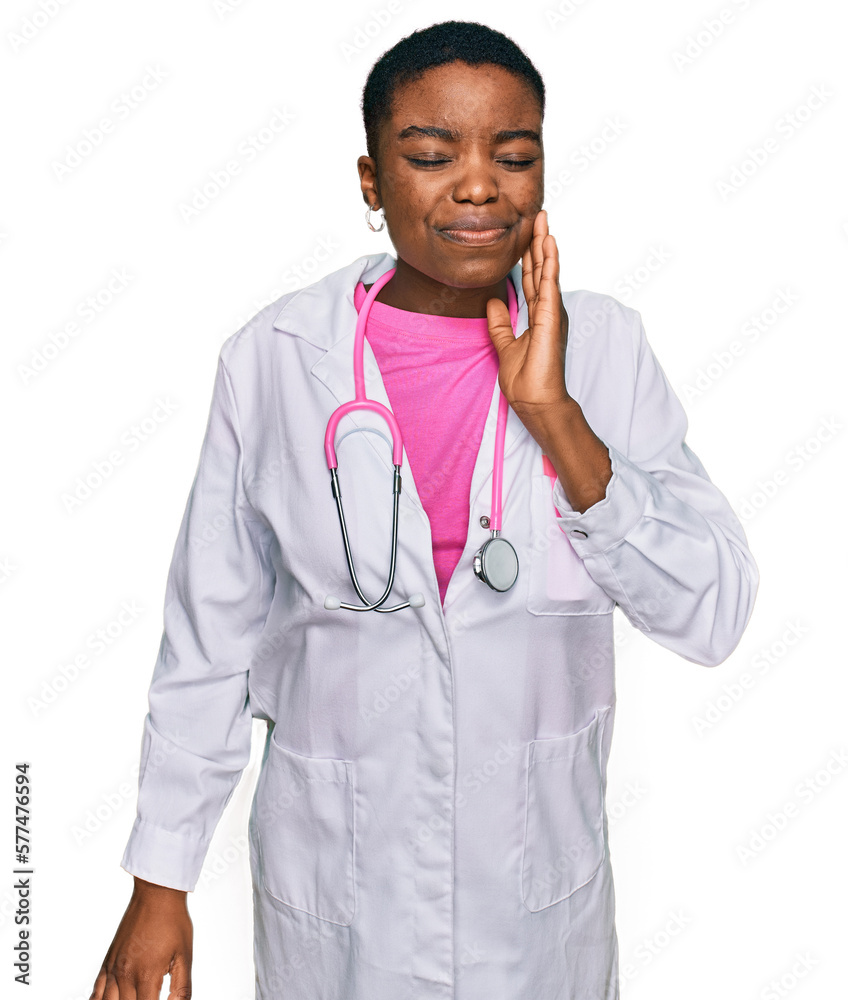 Canvas Prints Young african american woman wearing doctor uniform and stethoscope touching mouth with hand with painful expression because of toothache or dental illness on teeth. dentist