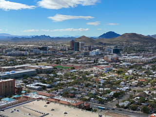 Tucson downtown modern skyscrapers aerial view with Tucson Mountain at the background in city of Tucson, Arizona AZ, USA. 