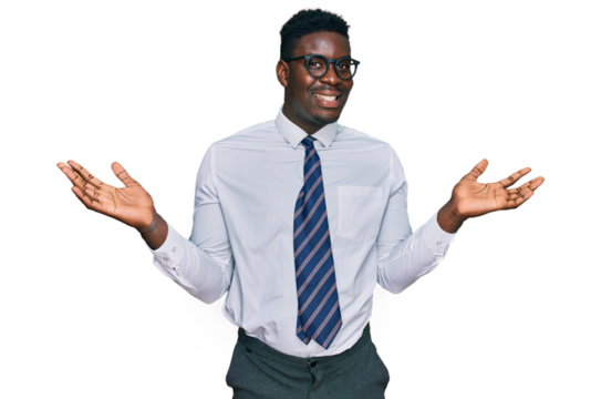 Handsome business black man wearing white shirt and tie celebrating victory with happy smile and winner expression with raised hands