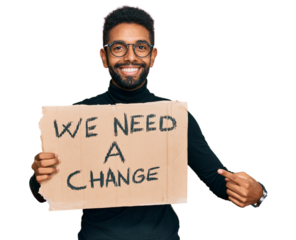 Young african american man holding we need a change banner smiling happy pointing with hand and finger