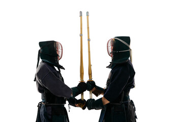 Sword to sword. Two men, professional kendo fighter, athletes in black uniform training against...
