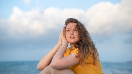 Naklejka premium Portrait of happy girl, young carefree woman enjoying summer vacation on sea, walking on beach sand, smiling and having fun in tropical country, relaxing on nature. Summertime, happiness concept.
