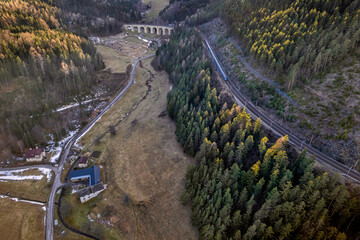 Aerial view of a passenger train crosses the Semmering Railway in Austria