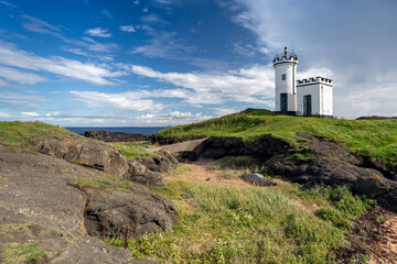 Fototapeta na wymiar Elie Ness Lighthouse stands on an outcrop of rocks on the Firth of Forth, Scotland