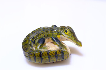 Little panamanian crocodile handmade on isolated white background, souvenir object