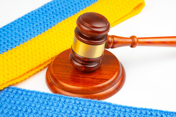 gavel of justice on the background of the Ukrainian flag