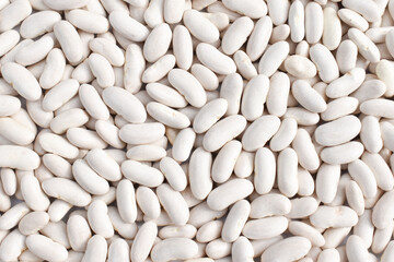 Legumes (beans). Background of many grains of dried beans. Texture of white beans. Food background....