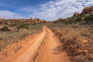 hiking the chesler park loop trail in the needles in canyonlands national park, usa
