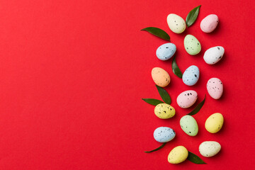 Happy Easter concept. Preparation for holiday. Easter eggs on colored background. flat lay top view copy space banner