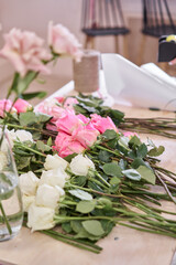 Florist prepares flowers. Fresh delivery in flower shop. European floral shop. Delivery fresh cut flower.