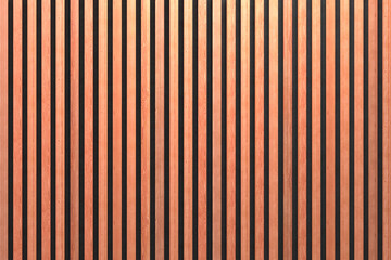 A wall of wooden slats in the color of natural wood with a pattern of wall panels in the background