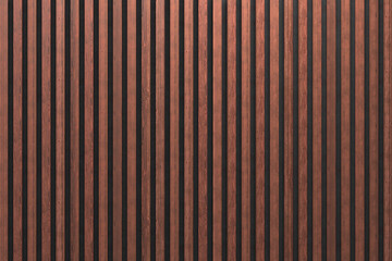 A wall of wooden slats in the color of dark wood with a pattern of wall panels in the background
